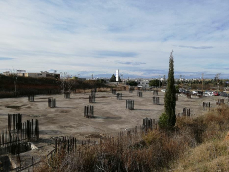 Plot of land with unfinished industrial building, 